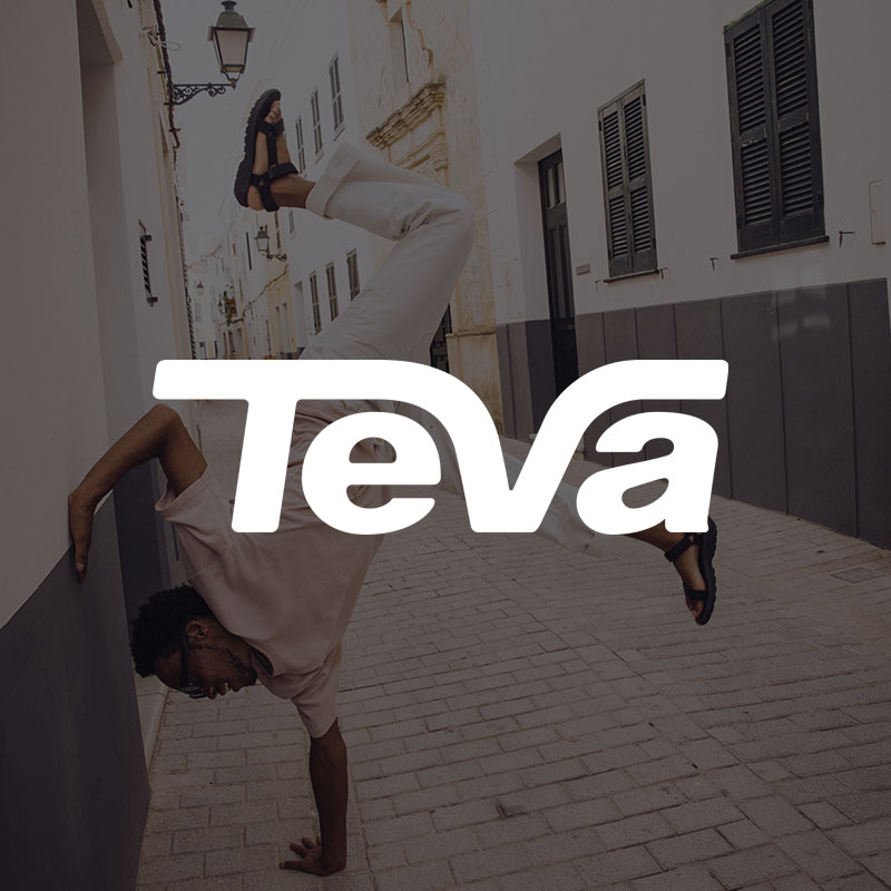 Teva logo and man doing a handstand