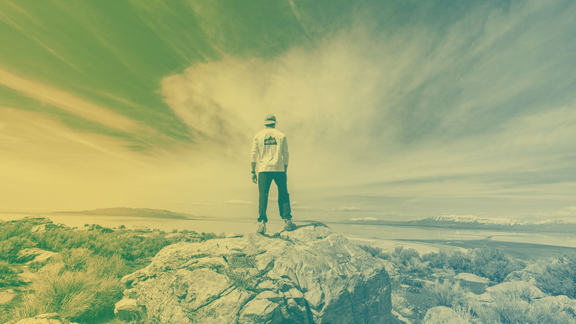 a person standing looking out over a vast landscape